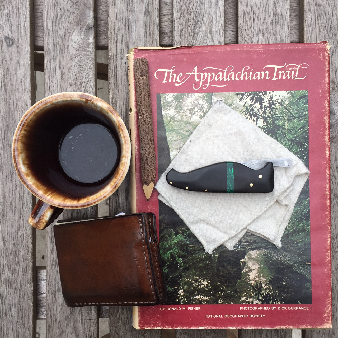 knife with coffee cup and notebook